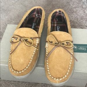 Clark’s men cinnamon color slippers. Size 11